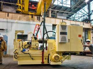 photograph of men with crane