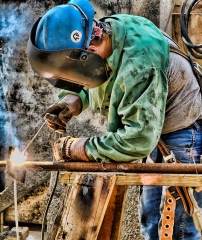 headshot of a welder working