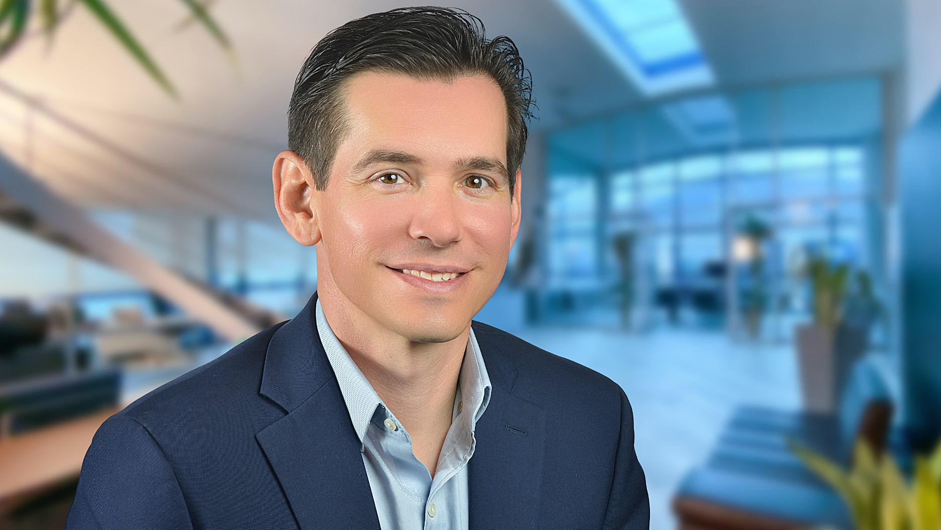 Headshot of business man in office building Headshot of business man in office building